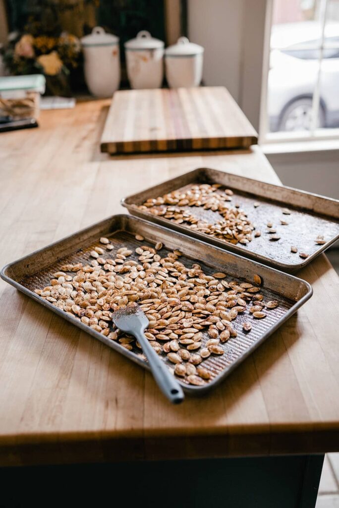 image of two trays of roasted pumpkin seeds