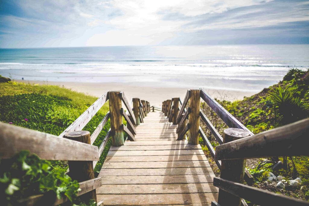 View of a boardwalk leading down to the beach to take with your beach accessories