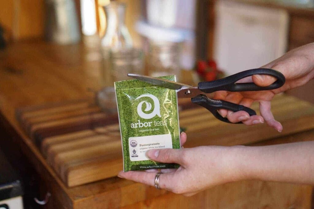 cutting open loose leaf tea packet